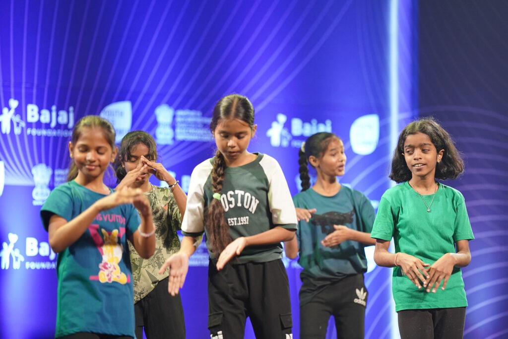 Students performing together on the Youth Eco Summit stage