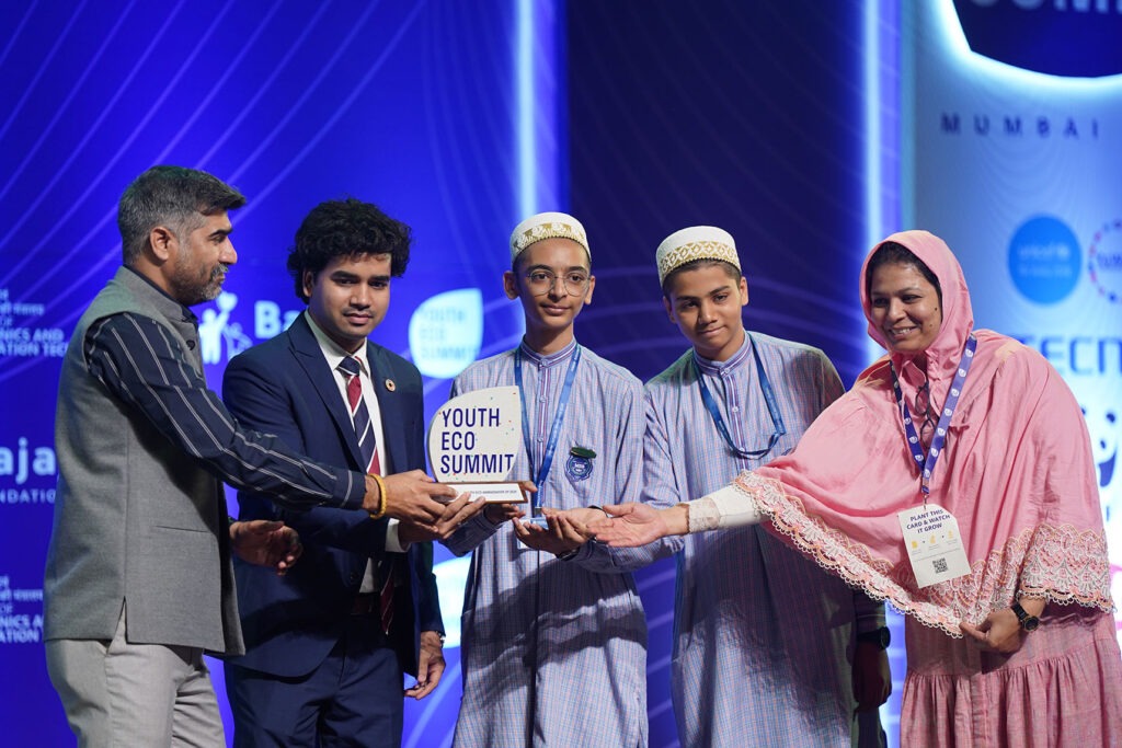 Students receiving awards together on the Youth Eco Summit stage