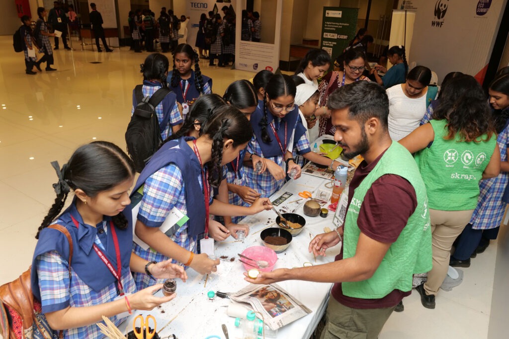 Students working with materials at a hands-on summit workshop