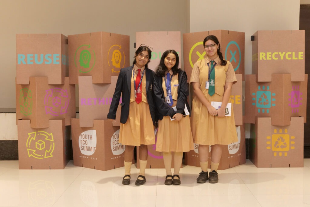 Students exploring a reuse and recycling display together